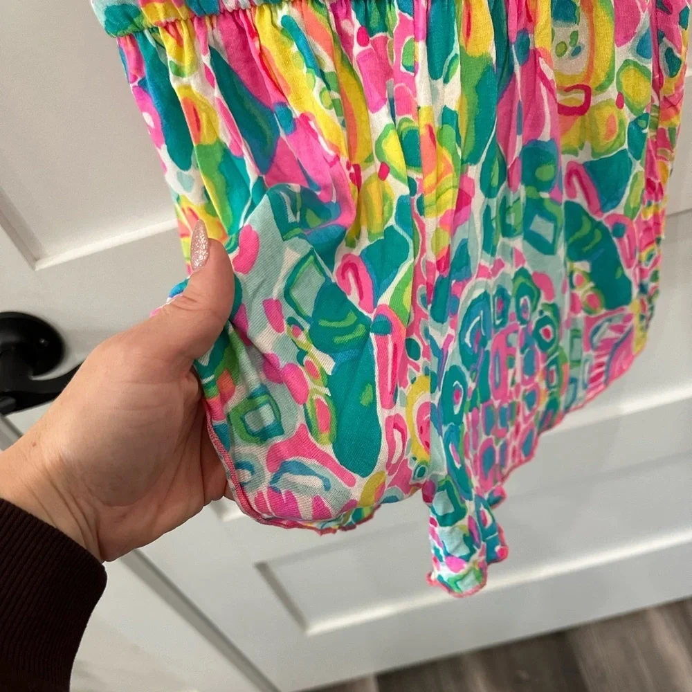 Lilly Pulitzer Vibrant Pink and Green romper.